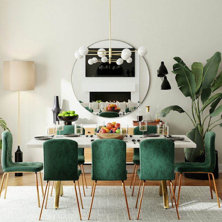 Dining area with emerald velvet chairs